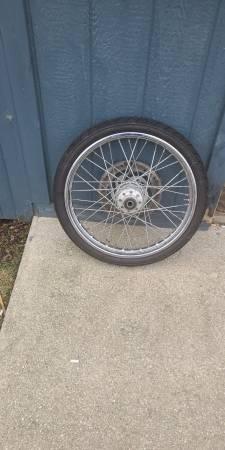 Front rim and tire off a 2000 softail standard and harley bag for back