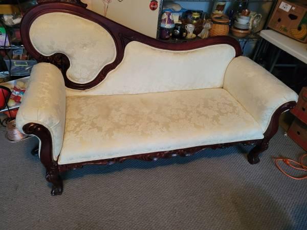 ornate decorative fancy couch with mahogany or cherry wood trim