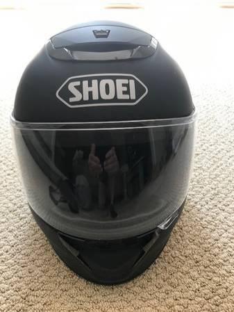 Two Shoei Qwest motorcycle helmets