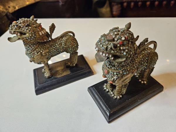 Antique bronze Foo Dogs covered in stones