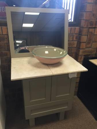 green bathroom vanity cabinet with matching mirror