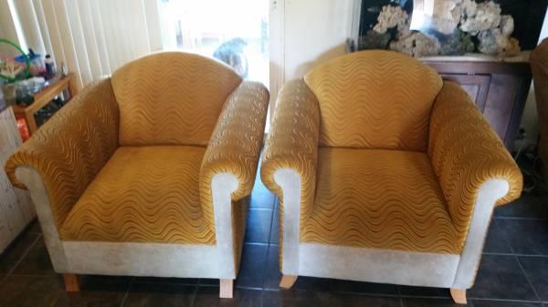Two free chairs, speakers, and outdoor heater on curb