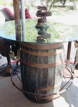 Glass top barrel table & 4 plow disc bottom, horse saddle, bar stools
